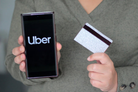 Mexico City, Mexico - Feb 22 2025: Uber is an application that is downloaded to your cell phone that...