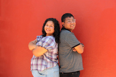 A young couple of 30-year-old dark-skinned Latino man and woman show their love and have fun together to celebrate Valentine's Day and their anniversaryのeditorial素材