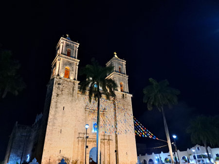 Merida, Yucatan, Mexico - Nov 22, 2022: Night view of the Temple of San Servacio and the Mestiza...