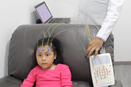 Electroencephalogram, a test that measures the brain's electrical activity, recording the brain...