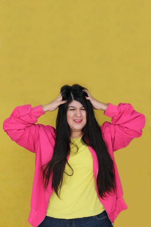 A 30-year-old Latina woman with long, straight hair is dissatisfied and frustrated with her dry,...