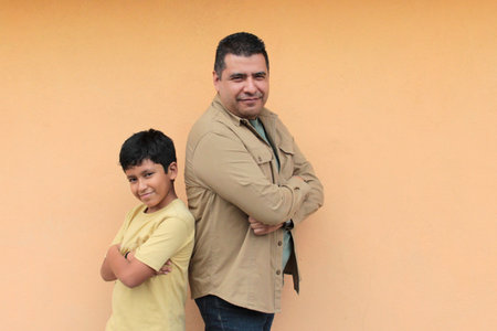 Single dad plays with his 10-year-old Latino son, spending time together to celebrate Father's Dayの写真素材