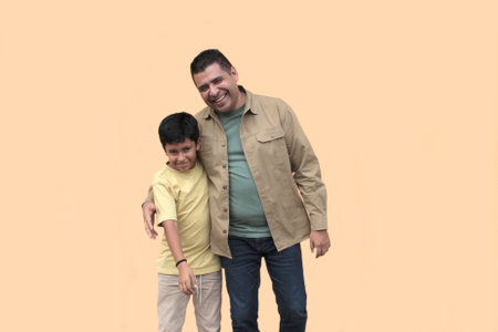 Divorced single dad plays with his 10-year-old dark-skinned Latino son, spending time together to celebrate Father's Dayの写真素材