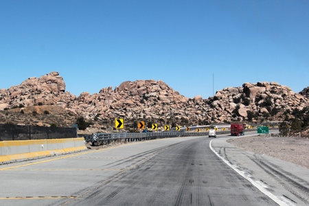 Tecate, Baja California, Mexico - Mar 18, 2025: Trailers travel along the dangerous and noisy...