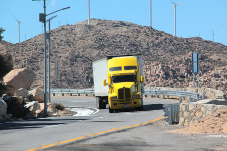 Tecate, Baja California, Mexico - Mar 18, 2025: Trailers travel along the dangerous and noisy highway from Tecate to Mexicali, Baja California, Mexicoのeditorial素材
