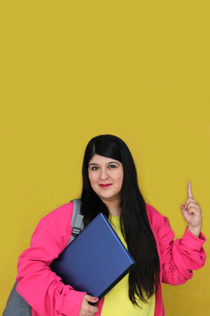 A successful and empowered 30-year-old Latina brings her laptop to study and work remotelyの写真素材