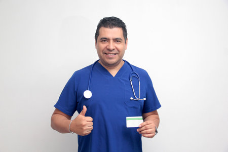 Dark-skinned Latino male doctor specialist shows cardの写真素材