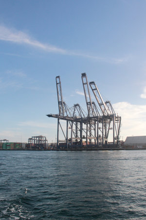 Ensenada, Baja California, Mexico - Mar 16, 2025: Harbor cranes are large machines used for loading...