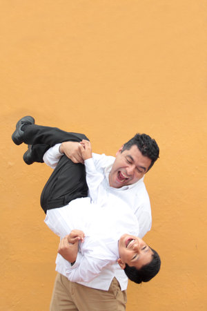 Single Latino dad plays with his 10-year-old son and spends quality time celebrating Father's Day