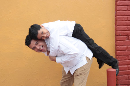 Single Latino dad plays with his 10-year-old son and spends quality timeの写真素材