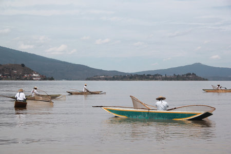 Patzcuaro, Michoacan, Mexico - Mar 21 2016: Butterfly fishermen, emblematic islanders of Lake Patzcuaro, in Michoacan, an identity symbolのeditorial素材