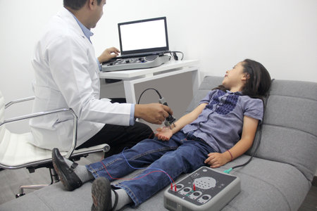 Electromyography EMG and Nerve Conduction Velocity NCV of the hand and arm in a 6-year-old Latina...