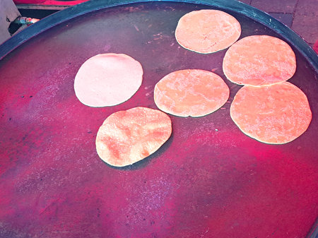 Mexican tortillas in a comal freshly made with corn dough in a town in Mexico, they are prepared to...