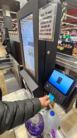 Mexico City, Mexico - Nov 4, 2025: Self checkout systems at La Comer in Mexico allow customers to...