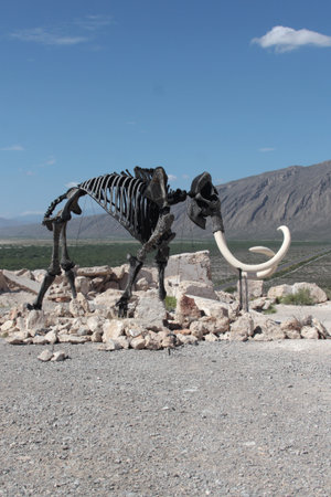Cuatro Cienegas, Coahuila, Mexico - Jul 28 2025: Dinosaur skeletons in the Marble Mines of Cuatro Cienegas, Coahuila, Mexico among mountainous desert landscapeのeditorial素材