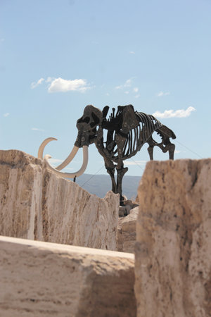 Cuatro Cienegas, Coahuila, Mexico - Jul 28 2025: Dinosaur skeletons in the Marble Mines of Cuatro Cienegas, Coahuila, Mexico among mountainous desert landscapeのeditorial素材