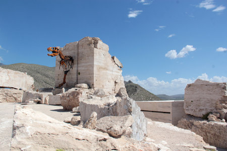Cuatro Cienegas, Coahuila, Mexico - Jul 28 2025: Dinosaur skeletons in the Marble Mines of Cuatro Cienegas, Coahuila, Mexico among mountainous desert landscapeのeditorial素材