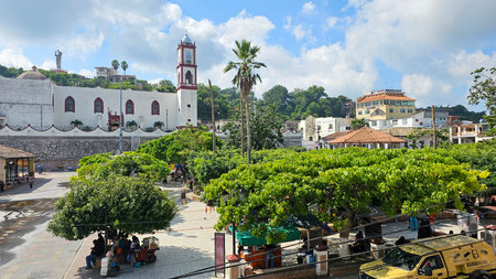 Papantla, Veracruz, Mexico - Oct 26, 2025: Parish of Our Lady of the Assumption in the magical town of Papantla in Veracruz, Mexico next to the Mural of the Totonac Cultureのeditorial素材