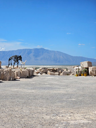 Cuatro Cienegas, Coahuila, Mexico - Jul 28 2025: Dinosaur skeletons in the Marble Mines of Cuatro Cienegas, Coahuila, Mexico among mountainous desert landscapeのeditorial素材