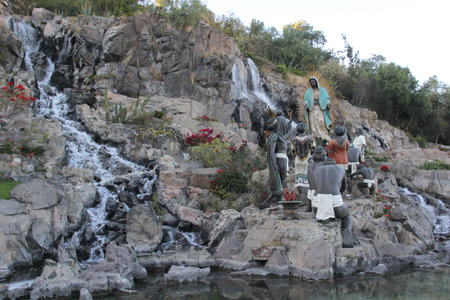 Mexico City, Mexico - Nov 25, 2024: Fountain of the sculpture group called La Ofrenda with the Virgin and indigenous people in the Basilica of Guadalupe in CDMXのeditorial素材