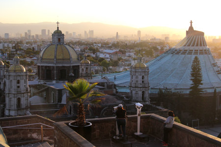Mexico City, Mexico - Nov 25, 2024: Sunset illuminates the viewpoint from the top of Tepeyac Hill overlooking the Basilica of Guadalupe in CDMXのeditorial素材