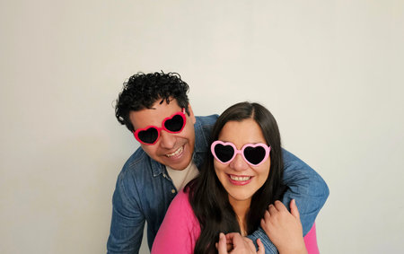 Latino couple of man and woman in their 40s show their love and celebrate Valentine's Day with...