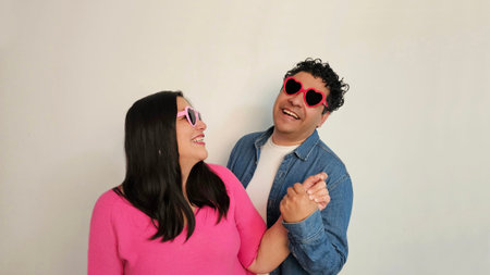 Latino couple of man and woman in their 40s show their love and celebrate Valentine's Day with...