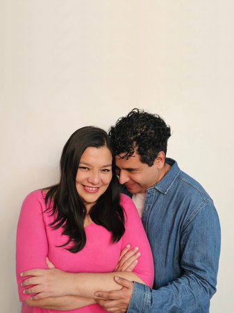 Latino man and woman in their 40s show their love to celebrate Valentine's Day and their anniversary...