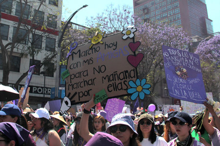 Mexico City, Mexico - Mar 8, 2025: 8M is the march held every March 8th for International Women's Day to demand equality, denounce violence, femicide, machismo and discriminationのeditorial素材