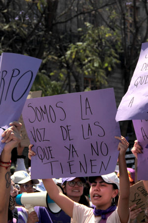 Mexico City, Mexico - Mar 8, 2025: 8M is the march held every March 8th for International Women's Day to demand equality, denounce violence, femicide, machismo and discriminationのeditorial素材
