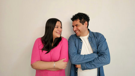 Latino man and woman in their 40s show their love to celebrate Valentine's Day and their anniversary...