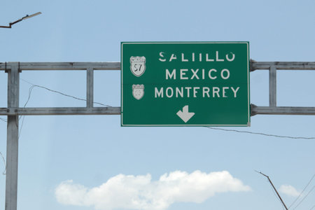 Highway signs for Monterrey show distance and direction to reach the capital