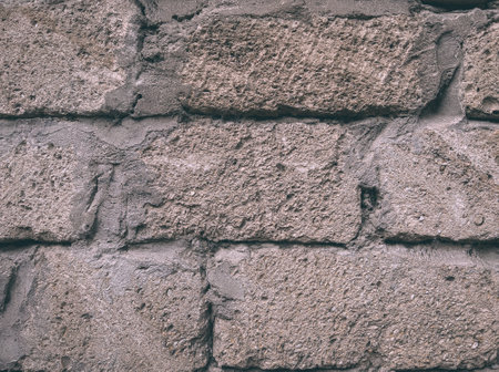Old rough brick wall texture close upの写真素材