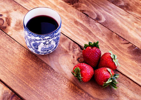 Set of teapot and chinese tea cups with strawberry teaの写真素材