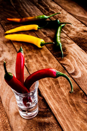 Chilli peppers of different colors: red, green, orange and yellow.の写真素材
