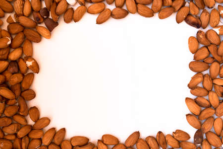 Almonds in the form of a frame with a white center.の写真素材
