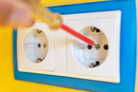Repair concept of electrical plugs inside the home.
