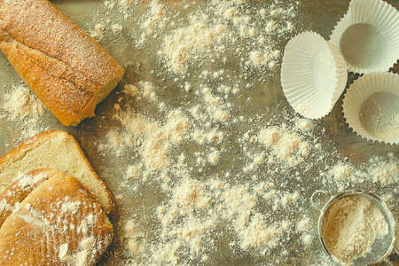 Bakery concept. Breads and pastry material on a gray metal tray with flour.の写真素材