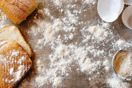 Bakery concept. Breads and pastry material on a gray metal tray with flour.の写真素材