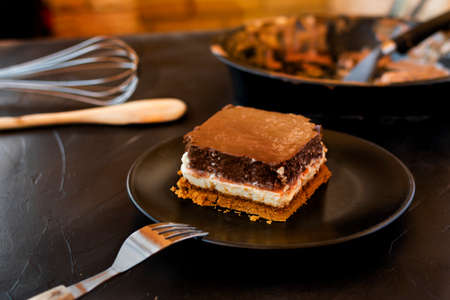 Delicious cake composed of three chocolates. White chocolate, milk chocolate and dark chocolate.
