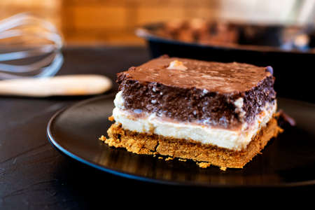 Delicious cake composed of three chocolates. White chocolate, milk chocolate and dark chocolate.