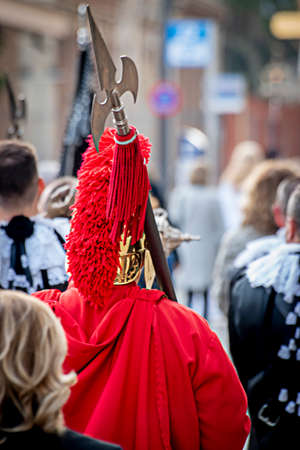 Person dressed as a Roman soldier in a procession in Spain.