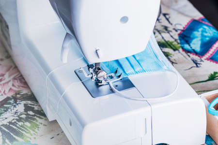 Sewing machine sewing masks for the COVID-19 pandemic.の写真素材