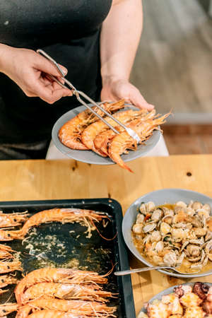 Different seafood dishes on the wooden table.の写真素材