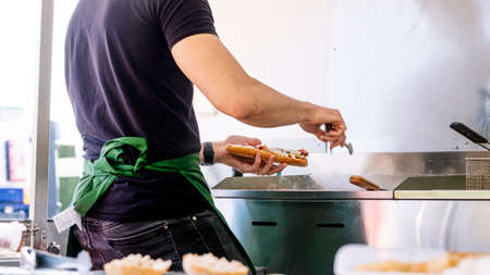 Food truck concept. Cook cooking on the griddle.の写真素材
