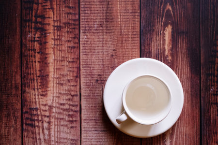 Empty coffee cup on a wooden background.の写真素材