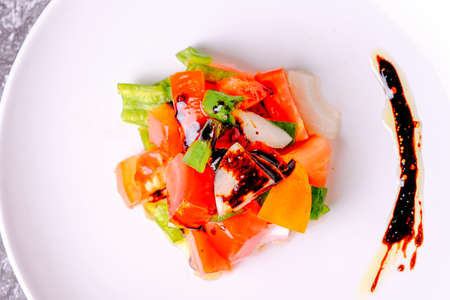 Mediterranean diet concept. Chopped tomato with onion and green peppers.の写真素材