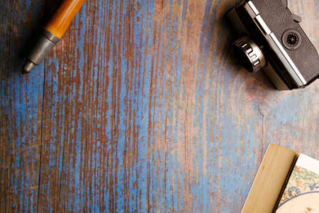 Scan background. Wooden background with camera, binoculars, cane...の写真素材