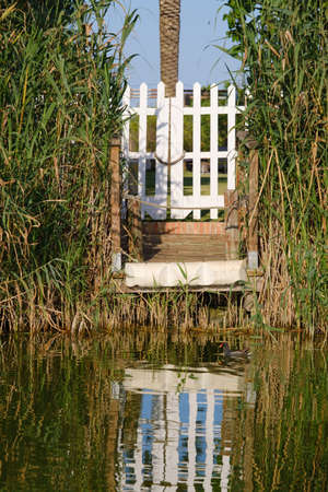 Door of a house that gives access to a lake.の写真素材