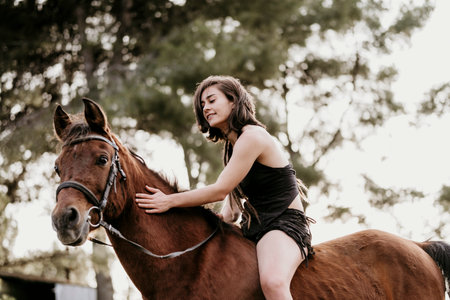 Amazon girl riding her horse without a saddle.の写真素材